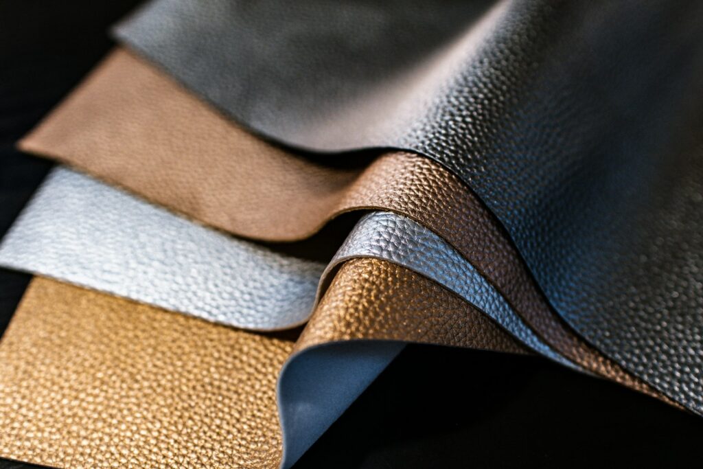 Sheets of leather in assorted colors (placeholder, Unsplash / Kelly Sikkema)