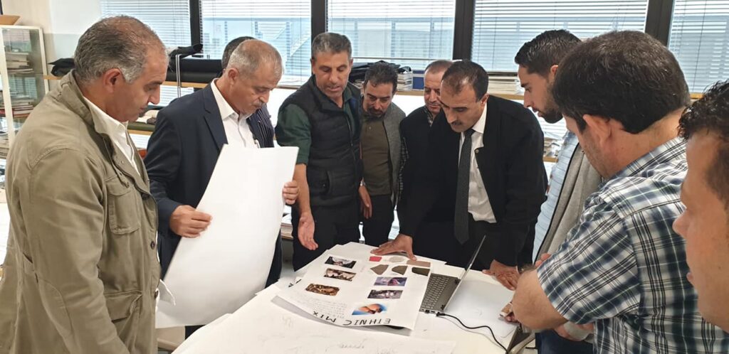 The NABOLY team reviewing a new sample board together