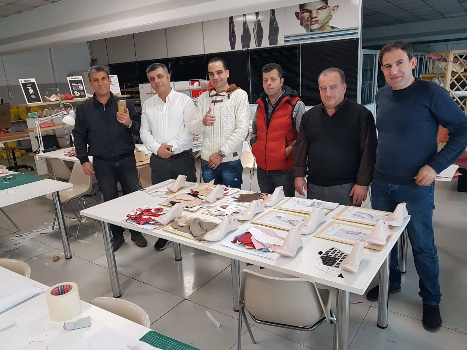 The NABOLY team reviewing patterns and samples around the development table